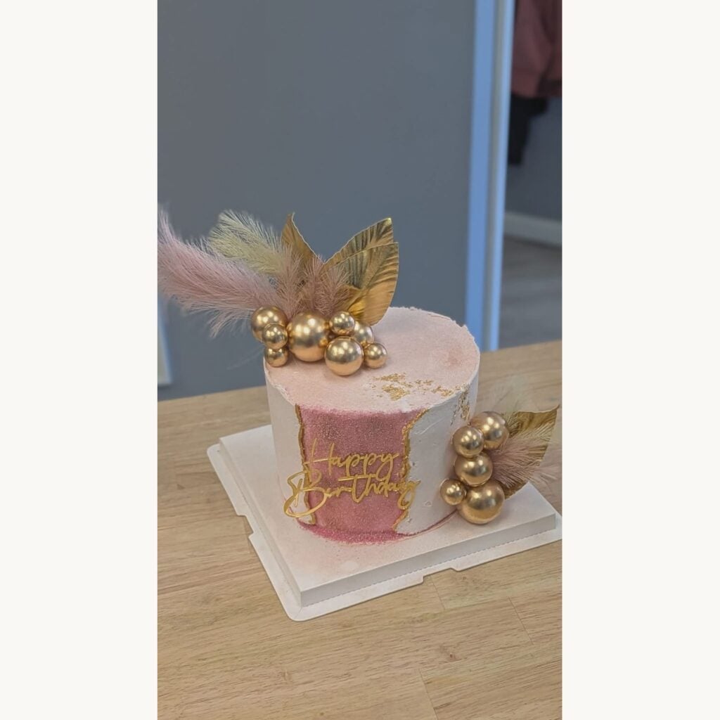 Pink and gold custom birthday cake from The Paperback Bakery at SereniTea Boutique