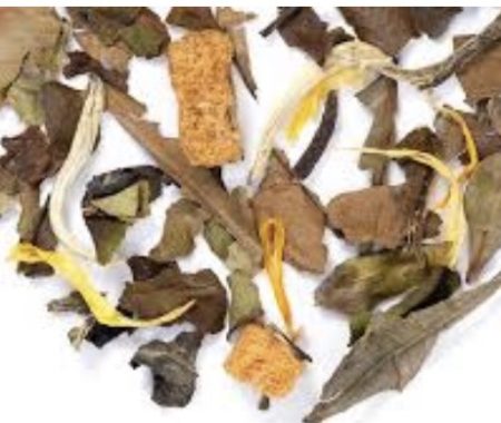 White tea blend with silvery leaves, dried fruit pieces, and marigold petals at SereniTea Boutique