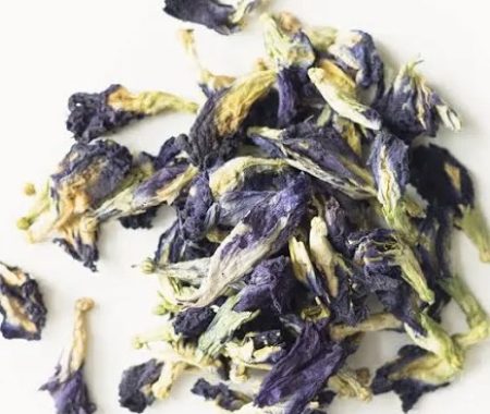 Dried blue and purple butterfly pea flowers in a small pile at SereniTea Boutique