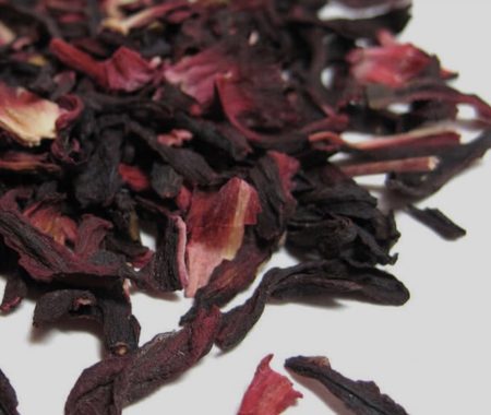 Deep red dried hibiscus petals in a close up at SereniTea Boutique