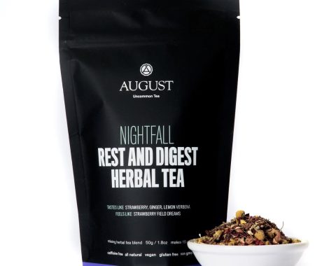 Rest and digest herbal tea pouch beside a white bowl of the relaxing chamomile blend at SereniTea Boutique
